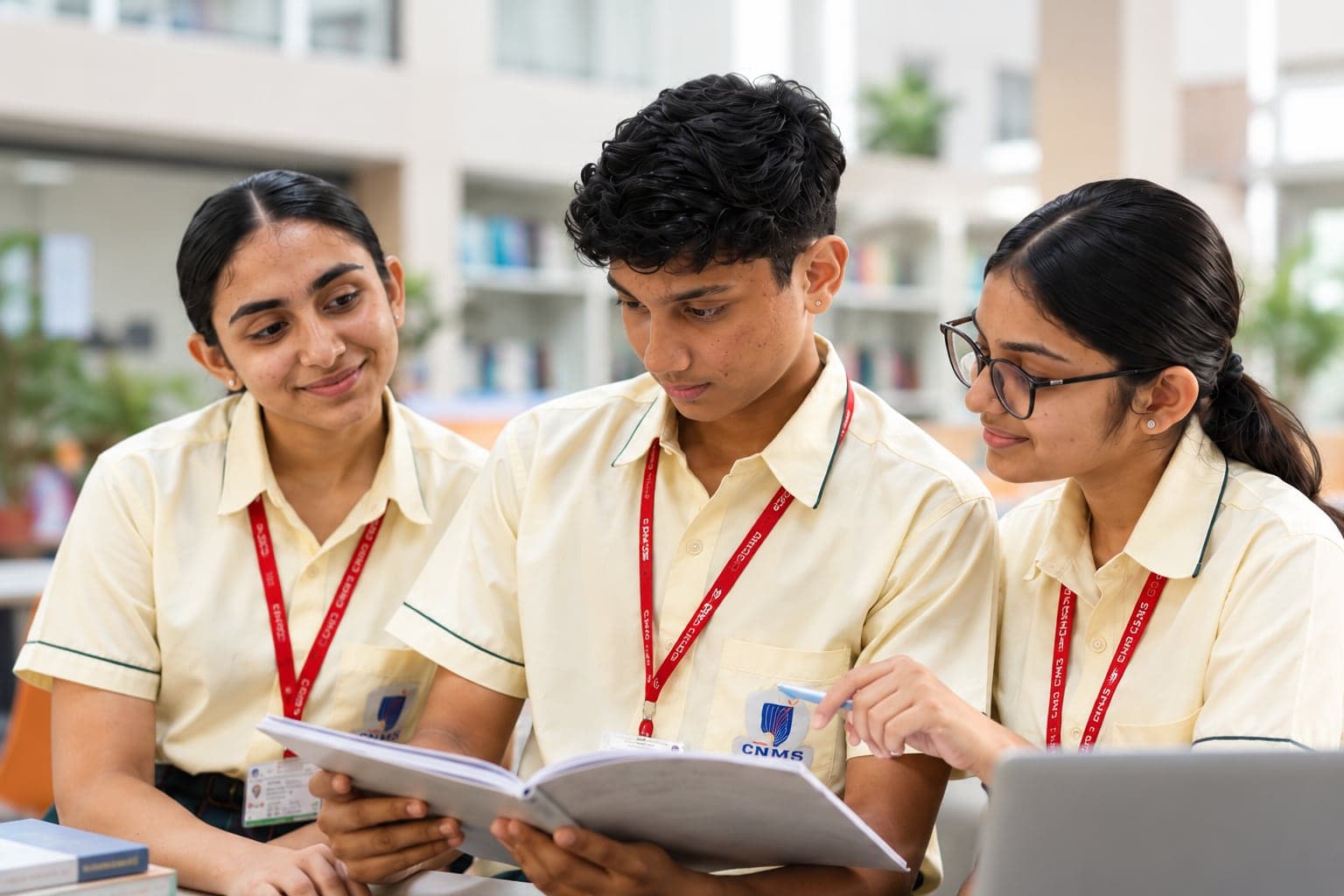 Three students reading together