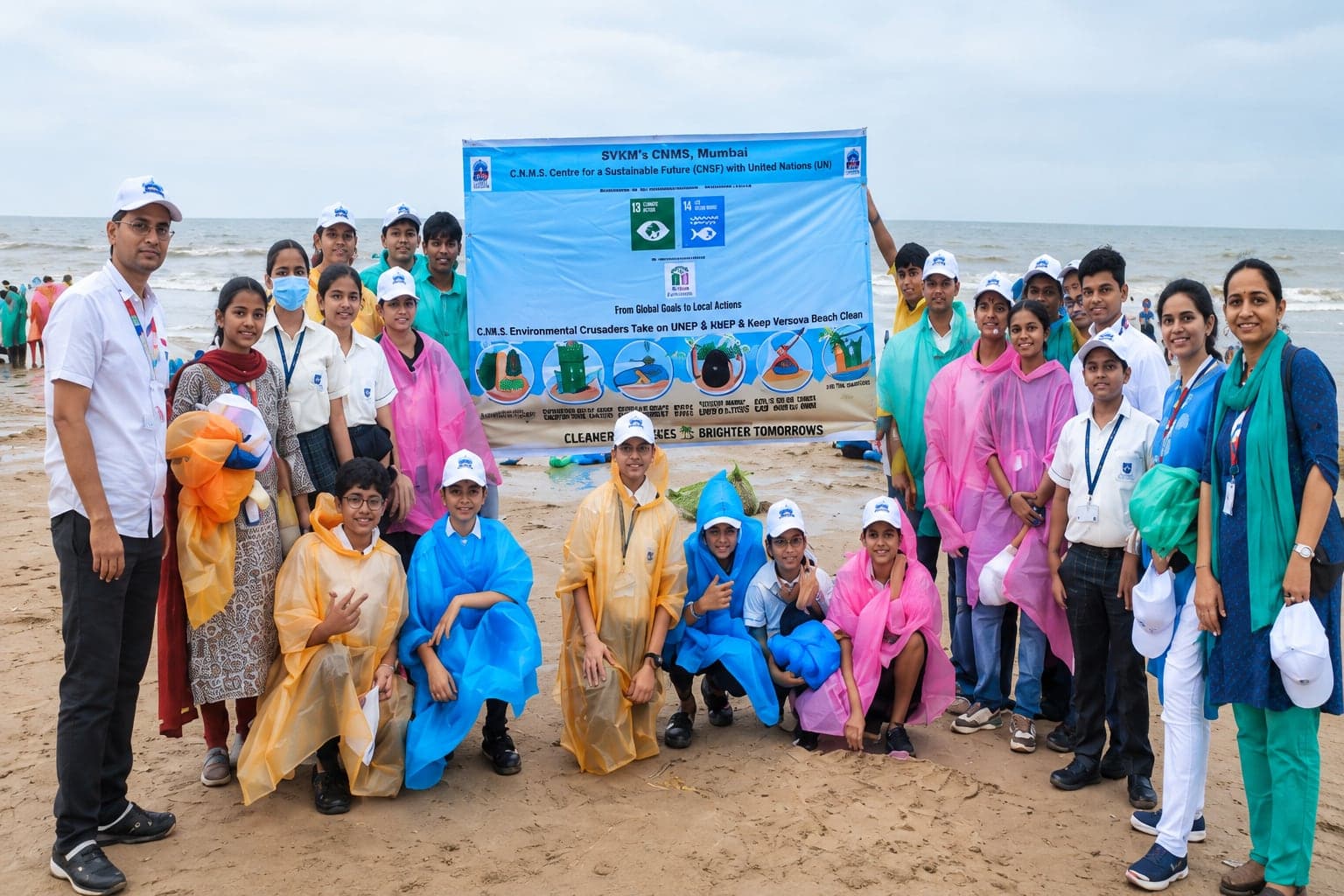 Students and teachers gathered on the beach for a clean-up drive