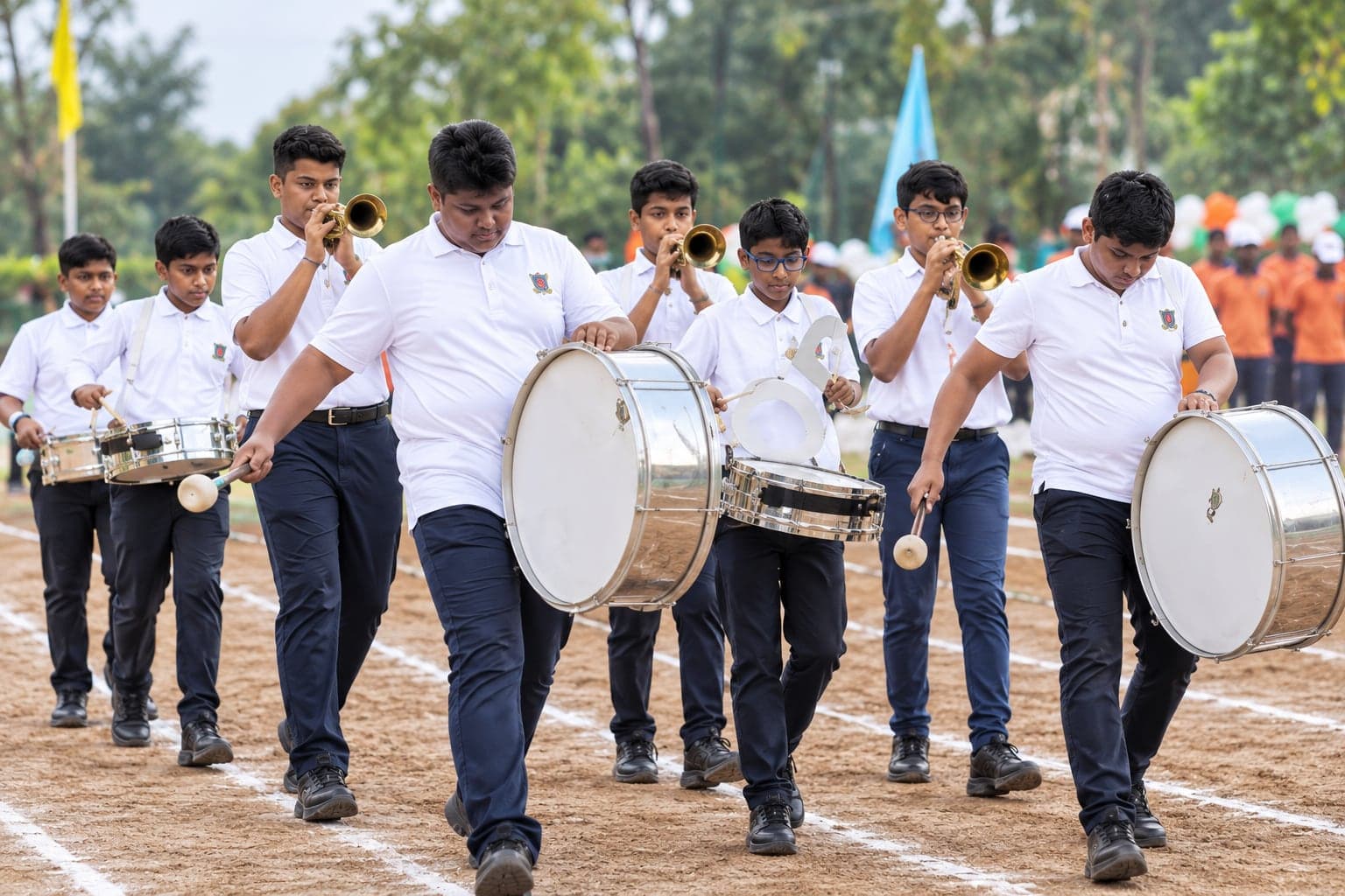 The Swarik Band marching with drums