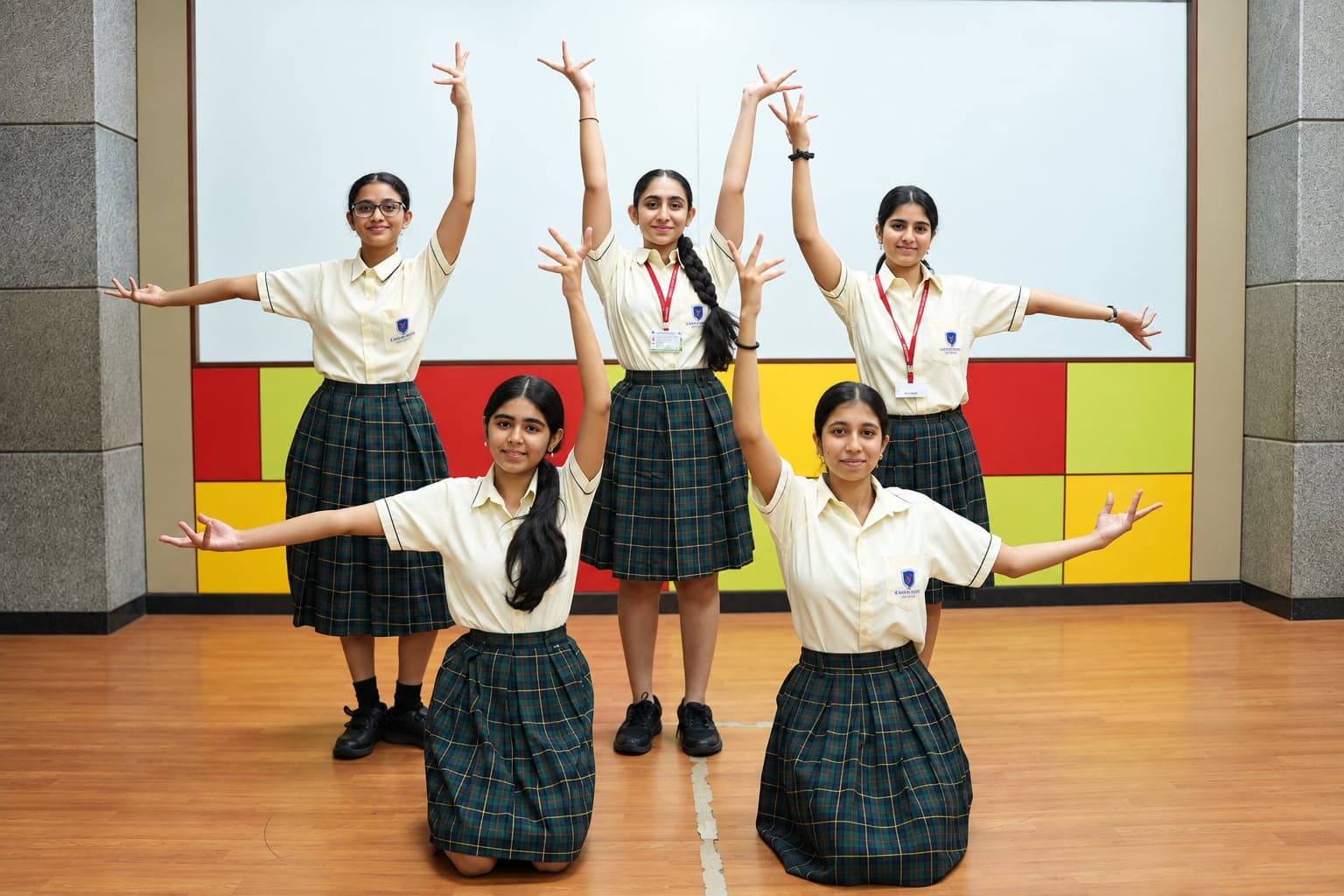 Students in a dance class striking a pose