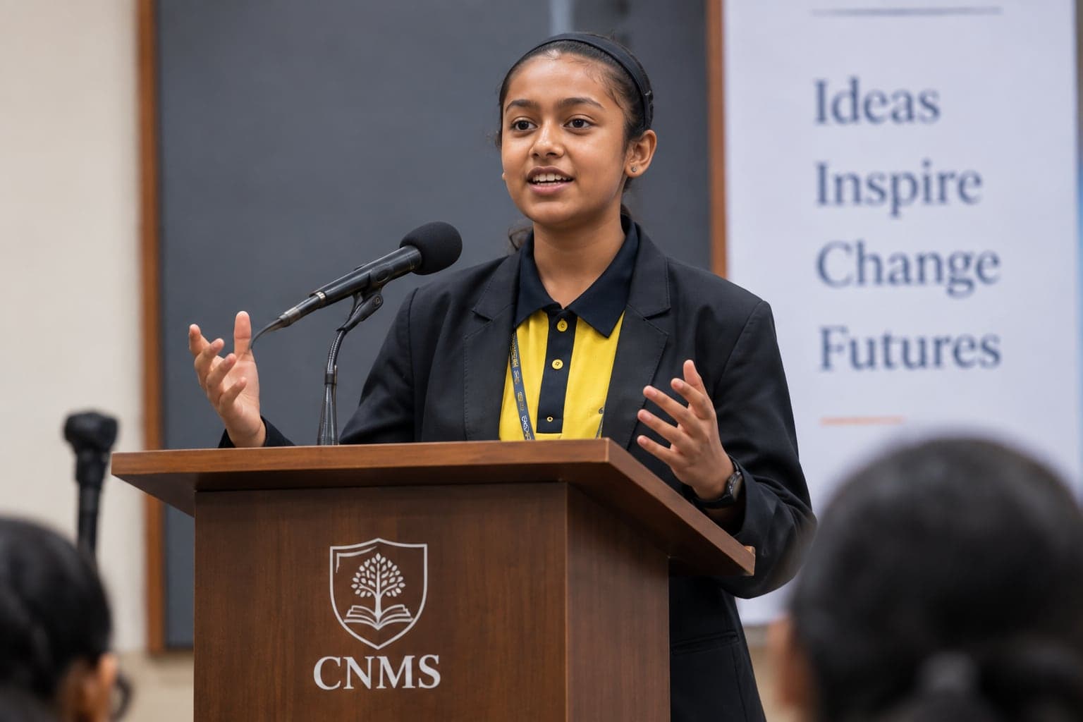 A student debating at a podium